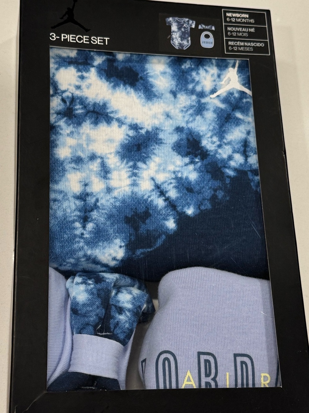 Jordan Baby 3-Piece Set - Light Blue Tie-Dye 6-12 Months - Bib / Hat / Bodysui